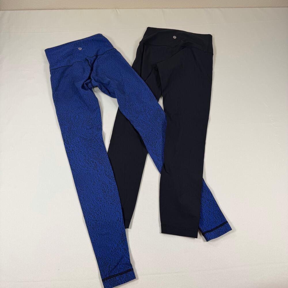Two pairs of Womens Lululemon size 4 leggings- good condition